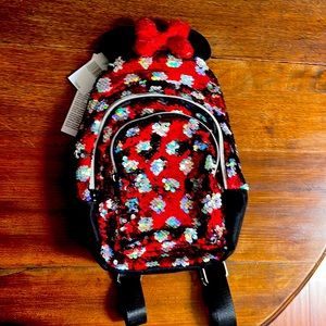 Brand new with tags rare sequined Minnie Mouse mini backpack.